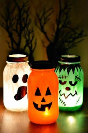 Mason jar, Orange, Lighting, Lantern, Pumpkin, Candy corn, Home accessories, Drinkware, Jack-o'-lantern, Plant, 