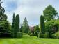 Сады Зала гильдии Ист-Хэмптона как художественное мероприятие с красивым массивом частных садов