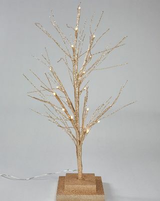 Kis pezsgő arany elemmel működő előre megvilágított gally karácsonyfa