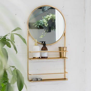 Goldener oder silberner runder Badezimmerspiegel mit Regalen