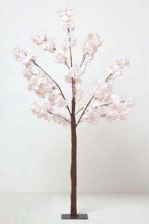 Stort ljusrosa konstgjorda blomningsträd